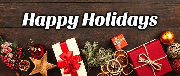 Happy Holidays with presents on a table in the background. 
